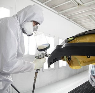 Collision Center Technician Painting a Vehicle | Universal Toyota in San Antonio TX