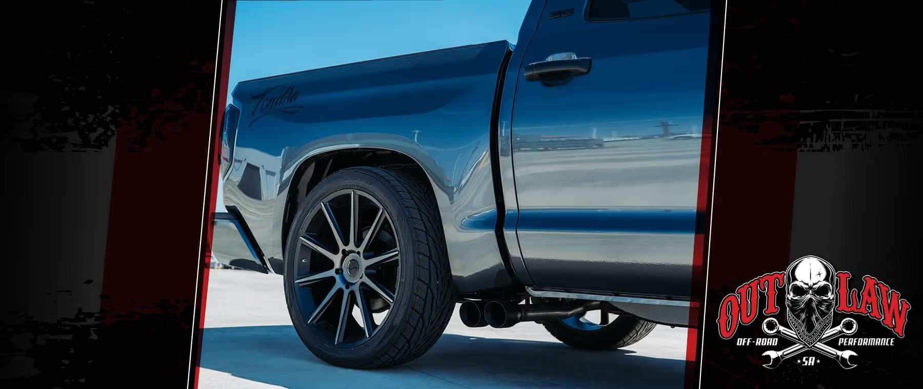 Custom black truck with aftermarket wheels by Outlaw Off-Road Performance